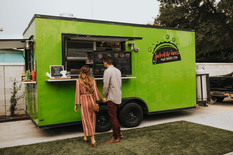 Picture Of Food Truck With People Standing Outside Ordering